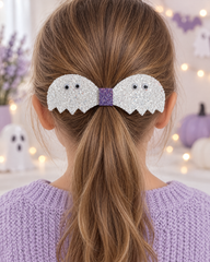 Ghostie Pair white glitter ghost hair clip on a girl's ponytail
