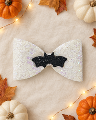 Moonlight Bat Halloween hair bow flat lay with mini pumpkins