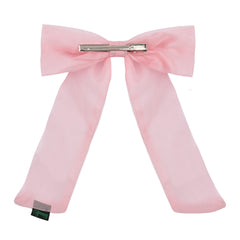 Back view of pink large organza hair bow showing metal clip attachment, ideal for secure and stylish wear.