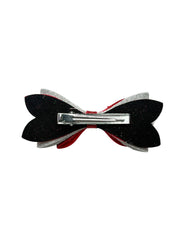 Back view of Christmas Glitter Hair Bow showing secure alligator clip for firm hold on girls' hairstyles.