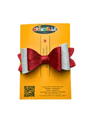 Christmas Glitter Hair Bow for girls displayed on branded Arendelle packaging, ideal for gifting during holidays.