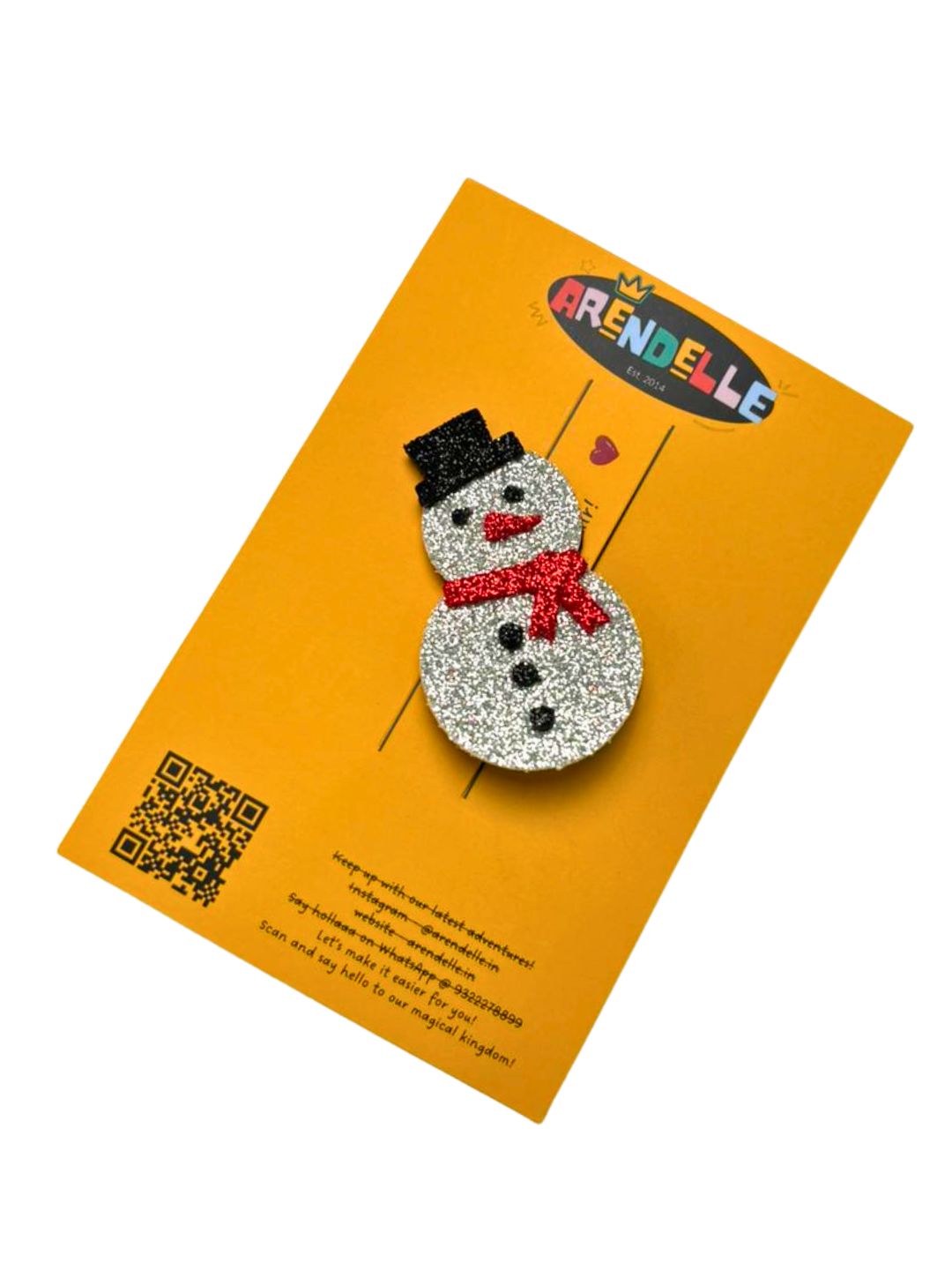Glitter Foam Snowman Hair Clip on branded Arendelle card packaging, ideal for gifting during the Christmas season.