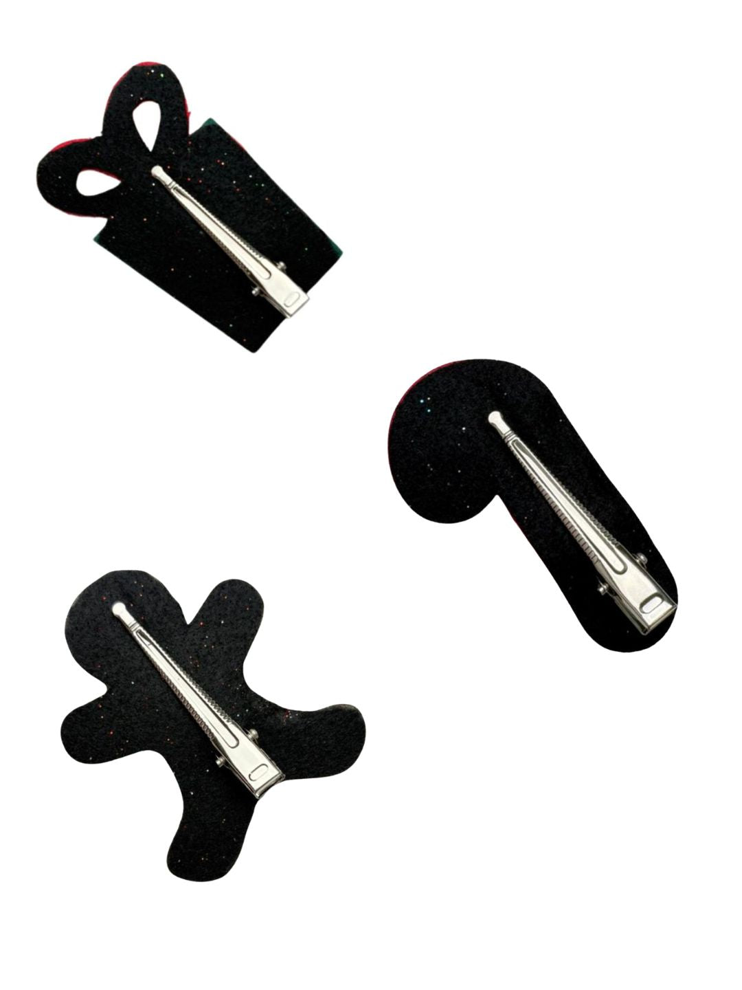 Back view of Arendelle Christmas Glitter Hair Pins showing secure metal clips on festive candy cane, gingerbread man, and gift box shapes.