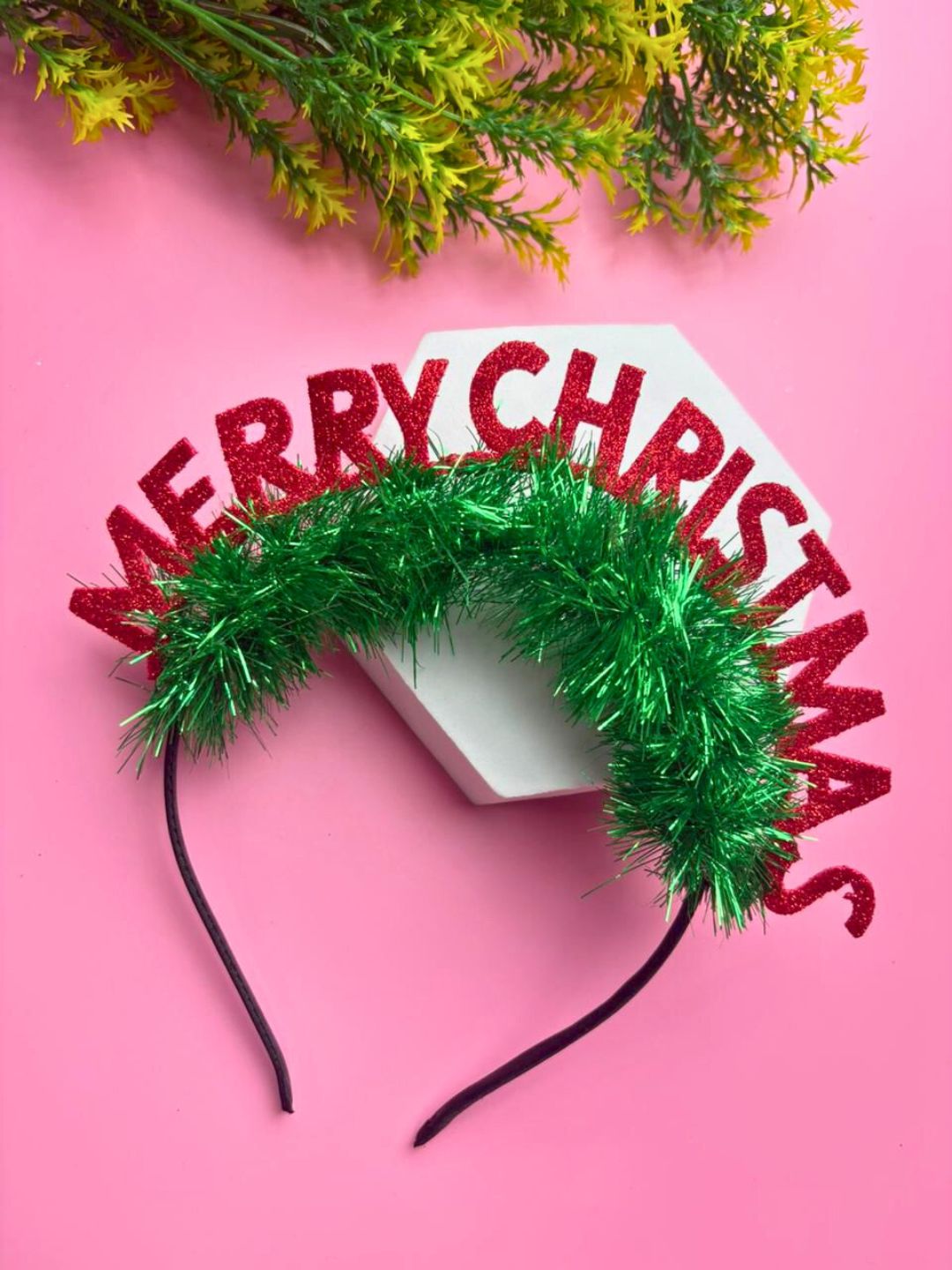 Festive Girls' Glitter Hair Band - Christmas Style on pink background with green tinsel and red glitter letters, ideal for holiday accessories.