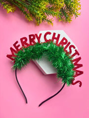 Festive Girls' Glitter Hair Band - Christmas Style on pink background with green tinsel and red glitter letters, ideal for holiday accessories.