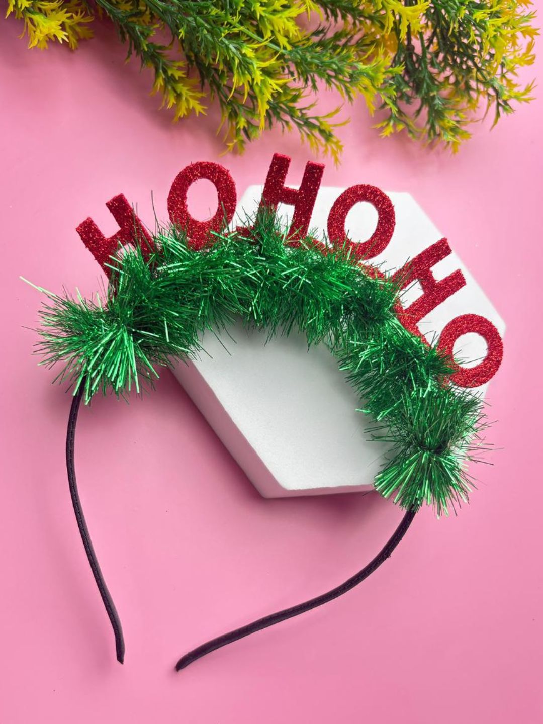 Adorable Christmas Glitter Hairband for Girls styled on a pink background, showcasing holiday sparkle and festive charm for young fashion.
