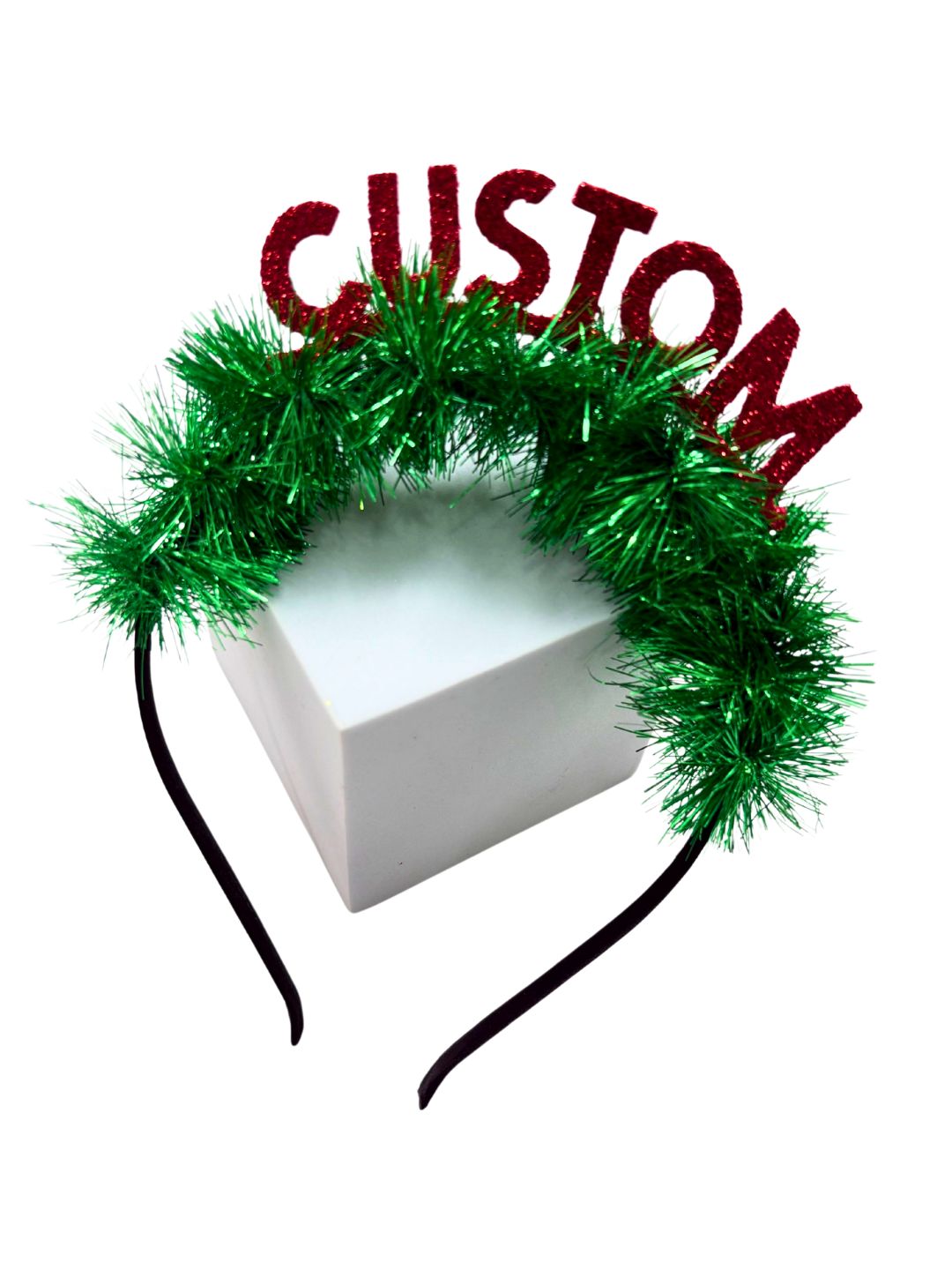 Adorable Christmas Glitter Hairband for Girls with red CUSTOM letters and fluffy green tinsel, styled on a white display box.