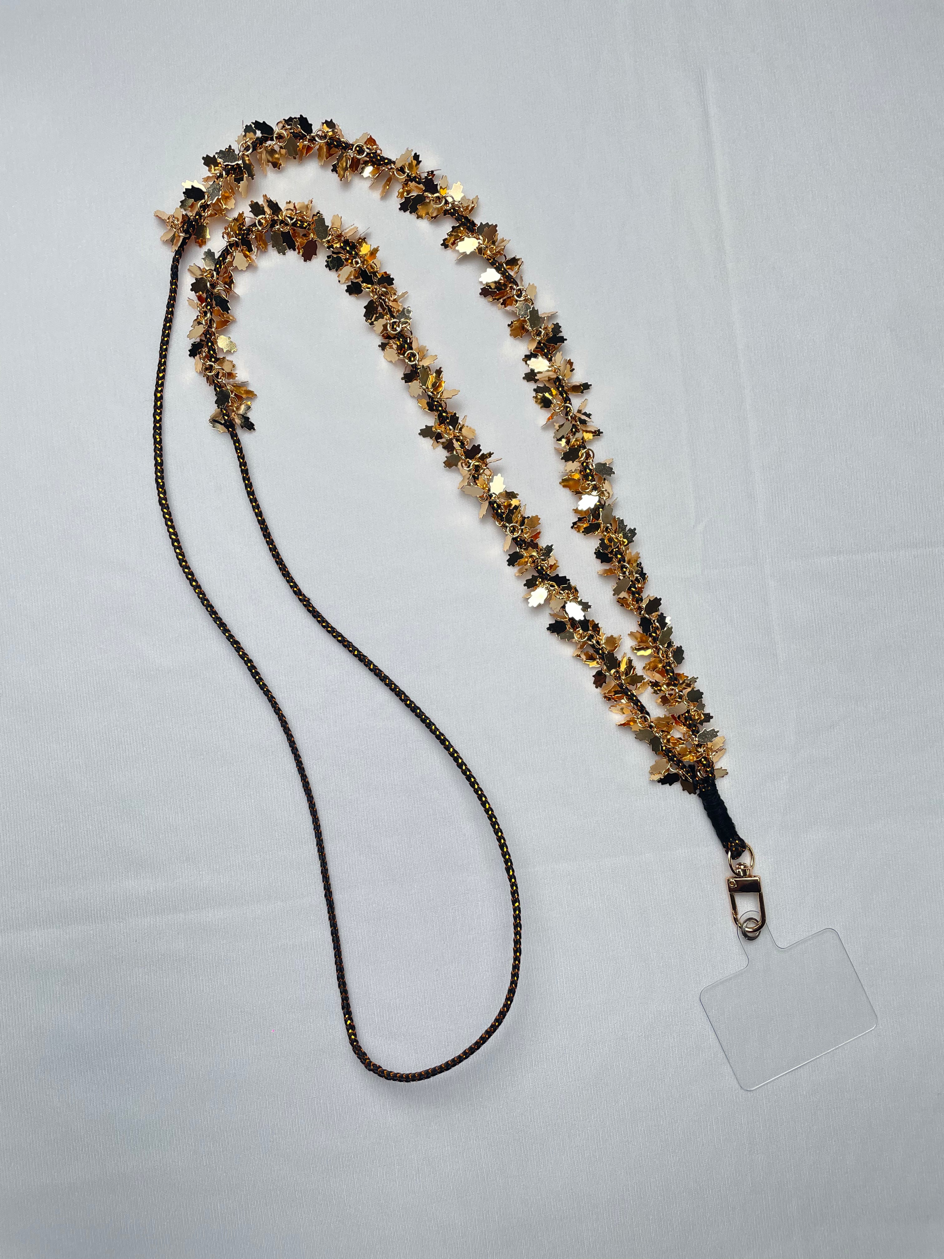 Arendelle Navratri Special Gold Hamza Hand Phone Sling with intricate gold detailing, ideal for ethnic celebrations and events.