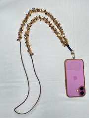 Festive Arendelle Hamza Hand Phone Sling attached to a pink phone, designed for Navratri wear with gold accents and traditional charm.