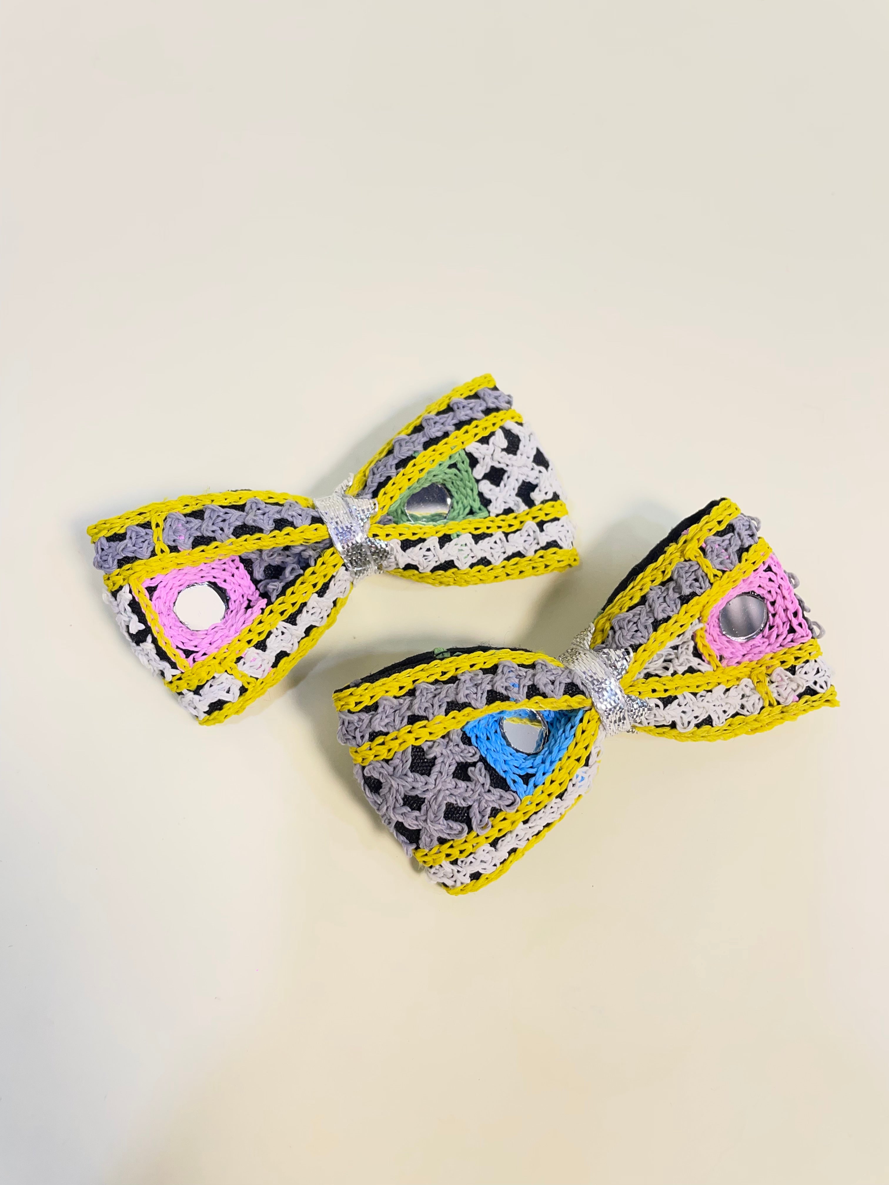 Close-up of Pari Hoon Main Bow Clip Set featuring multicolored crochet bows with silver accents, ideal festive hair pins for Navratri celebrations.