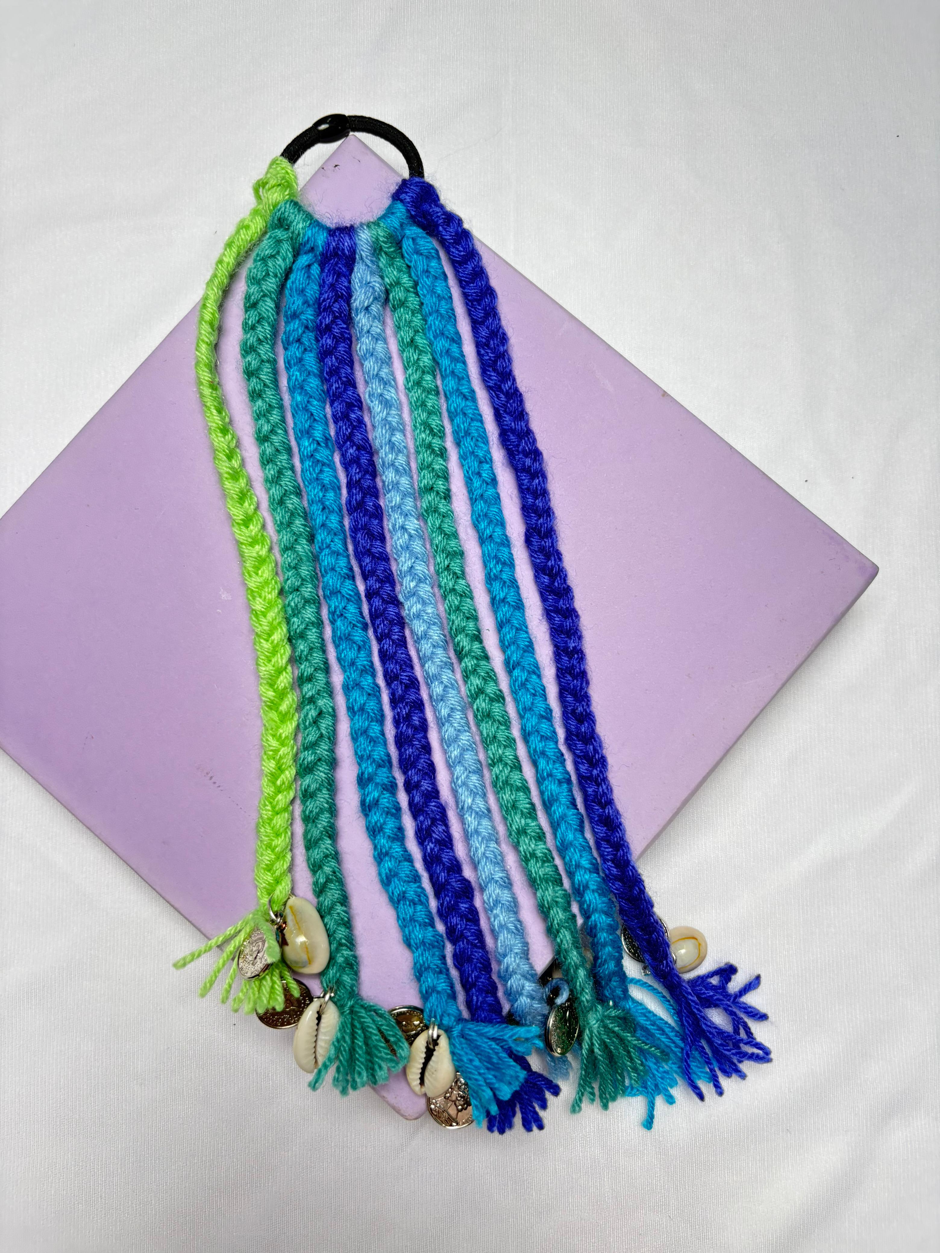 Navratri Hair Tassel Cords - Shades of Blue featuring braided yarn strands in green, teal, and blue with shell and bead accents, ideal for festive Garba looks.