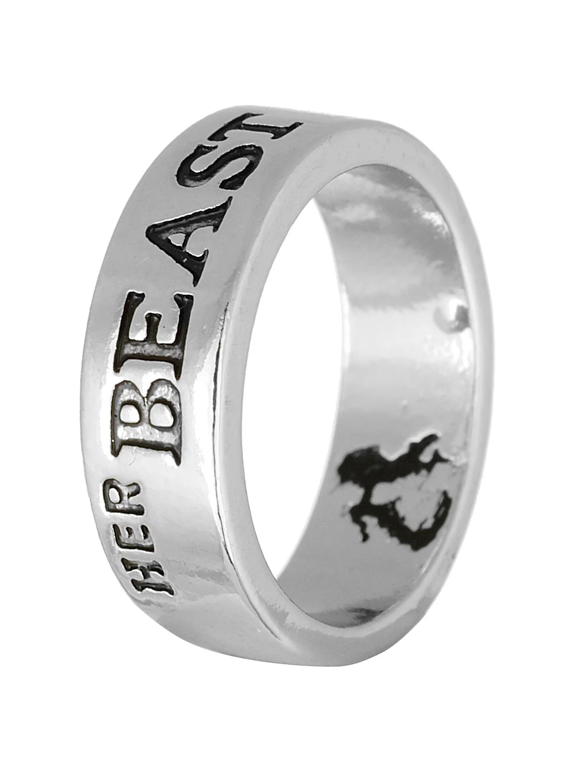 Close-up of Her Beast ring with engraved message and wolf design