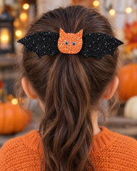 Batty Wings black glitter bat hair clip on a girl's ponytail