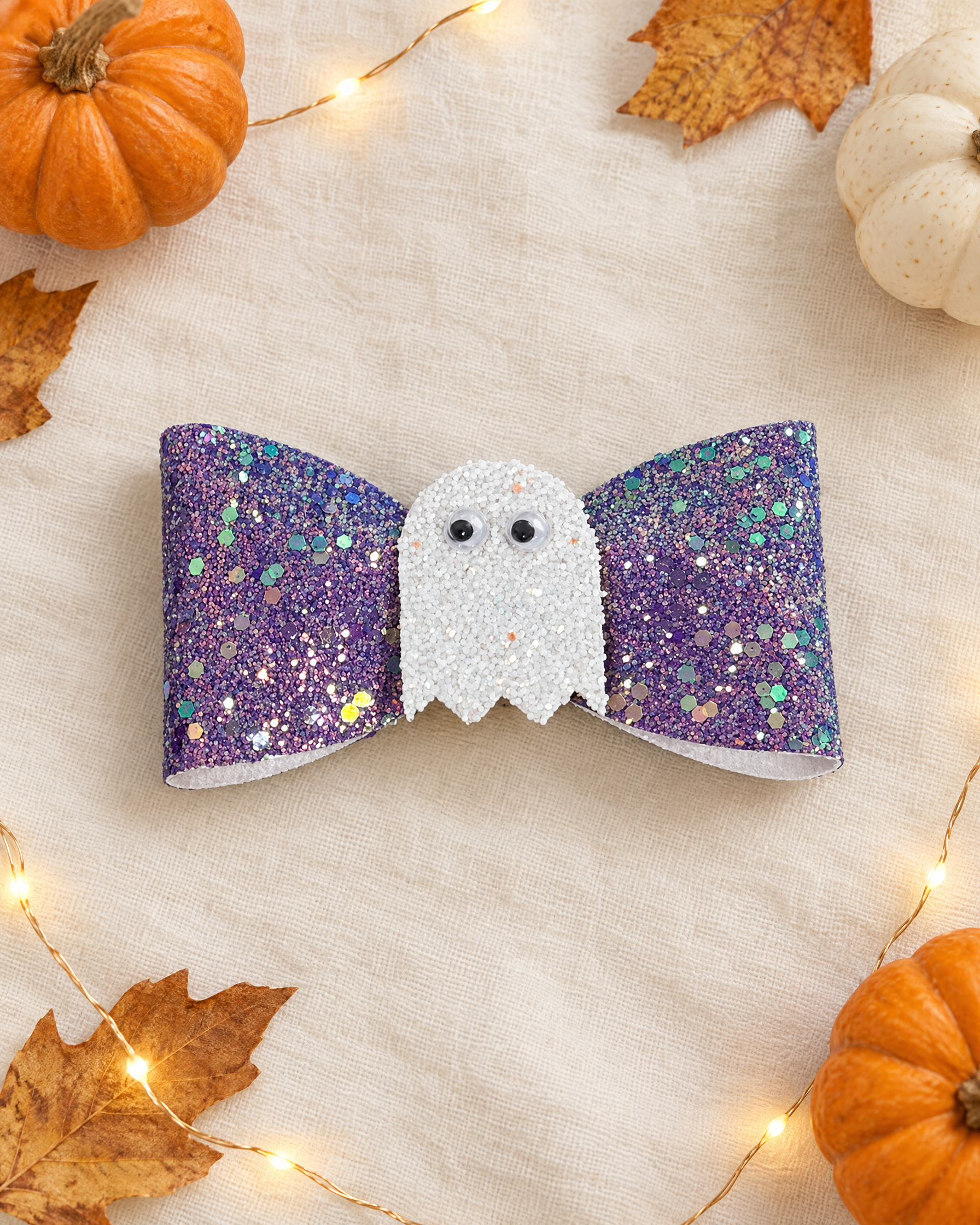 Lilac Boo Halloween hair bow flat lay with mini pumpkins